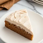 Slice of chai cake on a white plate.