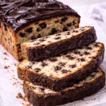 Chocolate chip loaf cake and three slices are cut.