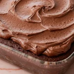 Chocolate zucchini cake in a glass baking dish.