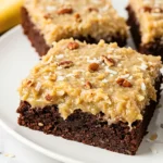 German chocolate brownies on a white plate.
