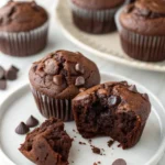 Healthy Chocolate Muffins with one muffin has a bite taken out of it.